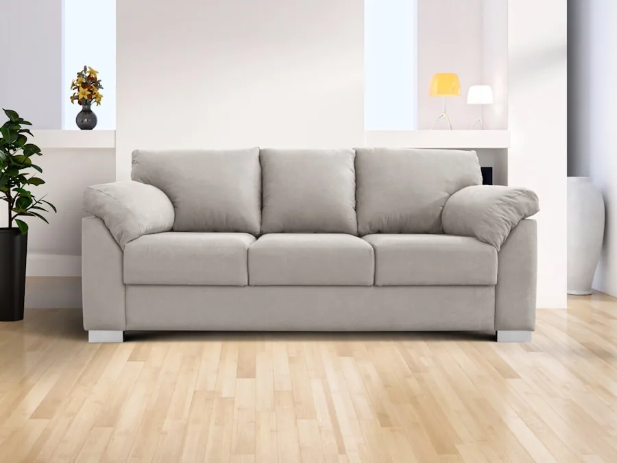 A three-seat sofa with firm boxed cushions and a straight back, on pale oak flooring.